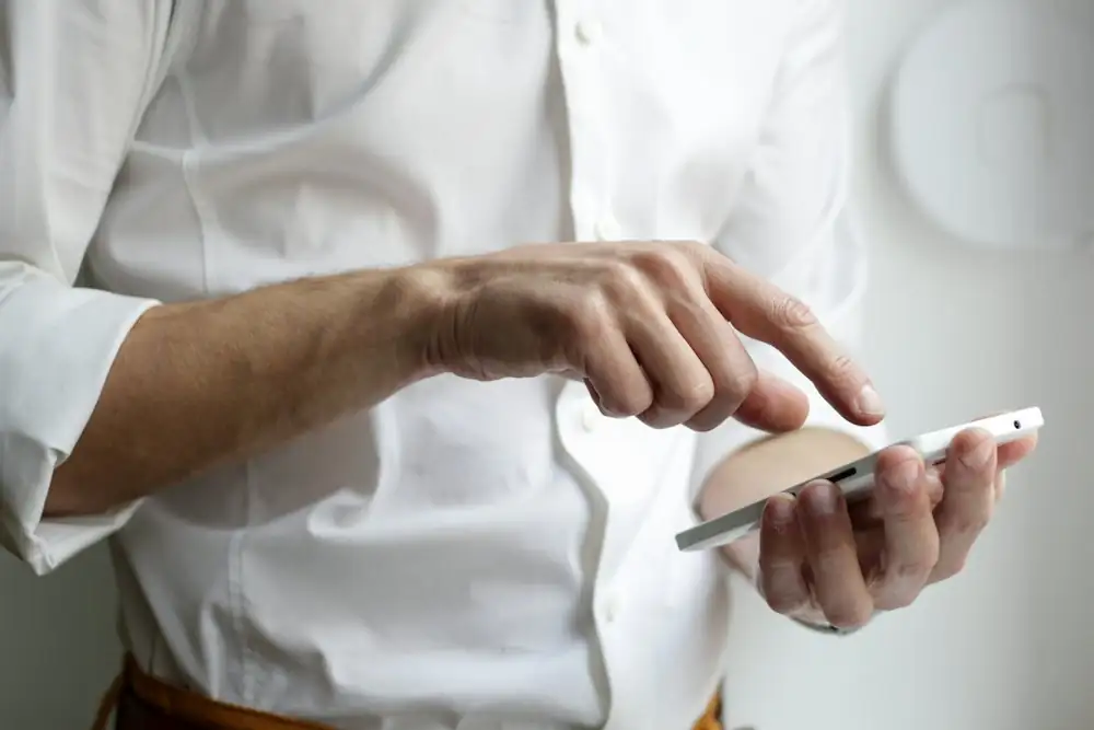 A hand holding a phone